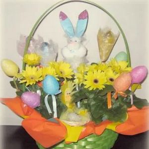 easter basket with eggs bunnies and daisies