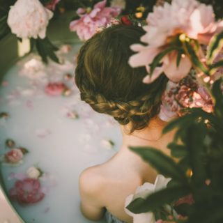 woman bathing in milk and roses