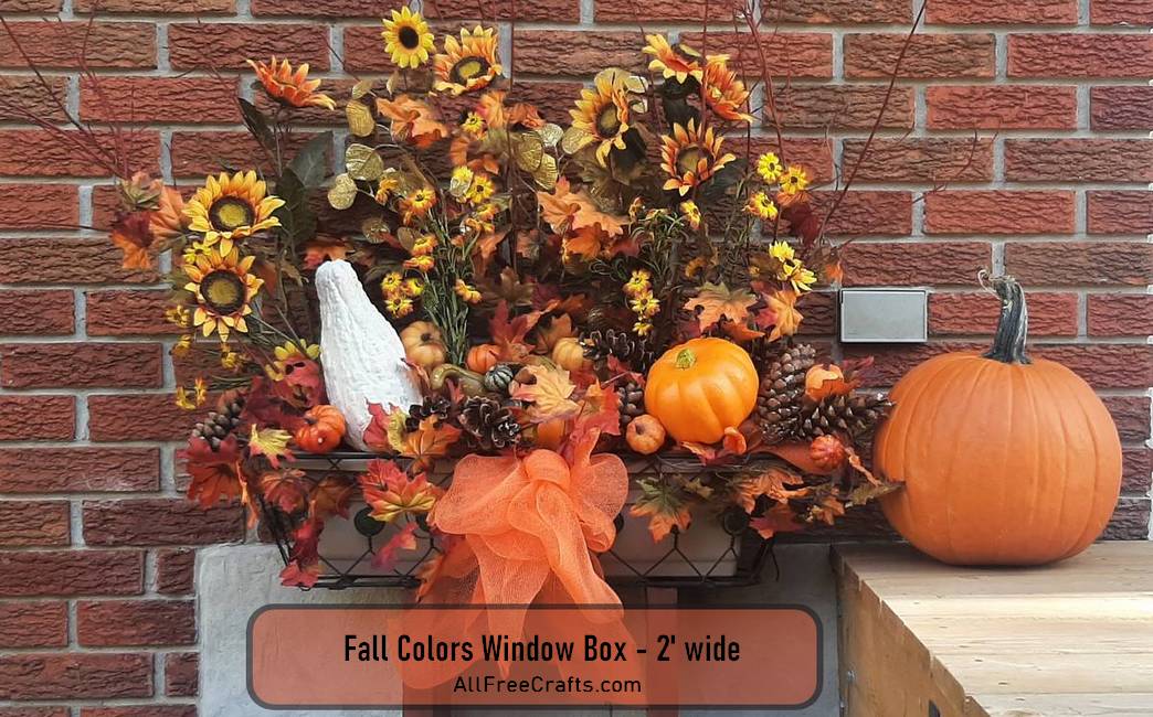 fall colors floral display in two foot wide window box