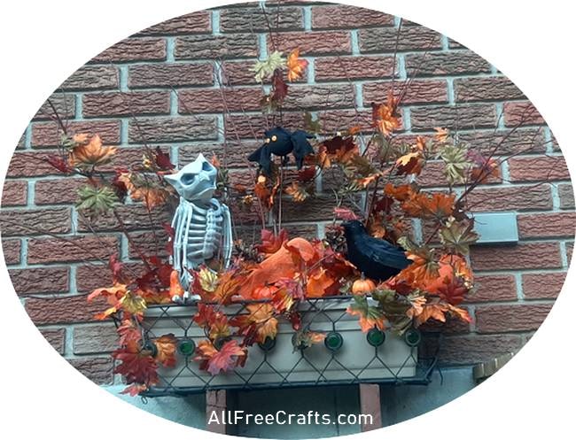 playing with elements to make a two foot window box fall or halloween display