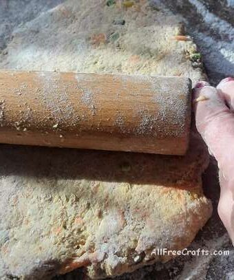 rolling out homemade dog cookie dough