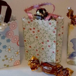 three completed tiny paper gift bags